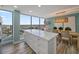 Modern kitchen with white cabinets, quartz countertops, and city views at 450 Gulfview S Blvd # 1708, Clearwater, FL 33767