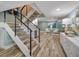 Modern staircase with wood treads and metal railing at 450 Gulfview S Blvd # 1708, Clearwater, FL 33767