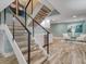 Modern staircase with wood treads and metal railing at 450 Gulfview S Blvd # 1708, Clearwater, FL 33767