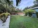 Backyard with tropical landscaping and wood fence at 4529 11Th S Ave, St Petersburg, FL 33711