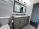 Bathroom with granite vanity and gray cabinetry at 4529 11Th S Ave, St Petersburg, FL 33711