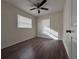 Bright bedroom with wood-look floors and ceiling fan at 4529 11Th S Ave, St Petersburg, FL 33711