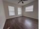 Spacious bedroom with wood-look floors and multiple windows at 4529 11Th S Ave, St Petersburg, FL 33711