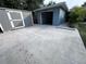 Concrete driveway with shed and attached garage at 4529 11Th S Ave, St Petersburg, FL 33711