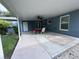 Covered patio with ceiling fan and seating area at 4529 11Th S Ave, St Petersburg, FL 33711