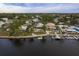 Aerial view of waterfront home with private dock and pool at 4536 Heavens Way, New Port Richey, FL 34652