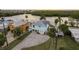 Aerial view of a waterfront home with a light blue exterior and nearby canal at 4536 Heavens Way, New Port Richey, FL 34652