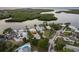 Bird's-eye view of canal-front homes and neighborhood at 4536 Heavens Way, New Port Richey, FL 34652