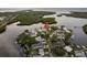 Aerial view of a house on a waterfront lot, showing surrounding area at 4536 Heavens Way, New Port Richey, FL 34652