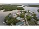 Aerial view showcasing a house's waterfront location in a community at 4536 Heavens Way, New Port Richey, FL 34652