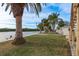 Landscaped backyard with water access and a view of the waterway at 4536 Heavens Way, New Port Richey, FL 34652