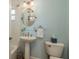 Small bathroom with pedestal sink, toilet and shower/tub combo at 4536 Heavens Way, New Port Richey, FL 34652