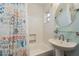 Bathroom with pedestal sink, toilet and shower/tub combo at 4536 Heavens Way, New Port Richey, FL 34652