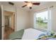 Bedroom with a queen bed, and access to a hallway at 4536 Heavens Way, New Port Richey, FL 34652