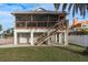 Two-story home with a screened porch and wooden deck at 4536 Heavens Way, New Port Richey, FL 34652