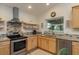 Stainless steel appliances and granite countertops in this updated kitchen at 4536 Heavens Way, New Port Richey, FL 34652