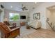 Living room with vaulted ceilings and access to deck at 4536 Heavens Way, New Port Richey, FL 34652