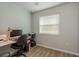 Home office with a desk, chair, and window with blinds at 4536 Heavens Way, New Port Richey, FL 34652