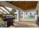 Covered patio with grill and water views at 4536 Heavens Way, New Port Richey, FL 34652