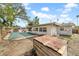 Backyard with inground pool and wooden structure at 4543 Indianapolis Ne St, St Petersburg, FL 33703