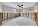 Grey bedroom with exposed framing and a ceiling fan at 4543 Indianapolis Ne St, St Petersburg, FL 33703