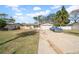 House exterior showcasing a front yard and driveway at 4543 Indianapolis Ne St, St Petersburg, FL 33703