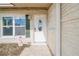 White front door with glass oval window and sidelights at 4543 Indianapolis Ne St, St Petersburg, FL 33703