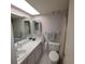 Bathroom with a toilet, sink, and shower at 4920 Locust Ne St # 203, St Petersburg, FL 33703