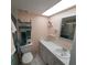 Bathroom boasts a vanity with shelves and a walk-in shower at 4920 Locust Ne St # 203, St Petersburg, FL 33703