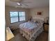 Bedroom with a queen-size bed and window at 4920 Locust Ne St # 203, St Petersburg, FL 33703