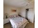 Bedroom with a queen-size bed and closet at 4920 Locust Ne St # 203, St Petersburg, FL 33703