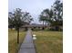 Paved pathway meanders through the community's lush green landscape at 4920 Locust Ne St # 203, St Petersburg, FL 33703