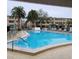 Inviting community pool with plenty of lounge chairs at 4920 Locust Ne St # 203, St Petersburg, FL 33703