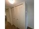 Hallway with double door closets offering additional storage at 4920 Locust Ne St # 203, St Petersburg, FL 33703