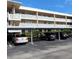 Exterior of building with assigned covered parking spots for residents at 4920 Locust Ne St # 203, St Petersburg, FL 33703