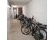 Indoor bike and storage area featuring white lockers and various bicycles for community use at 4920 Locust Ne St # 203, St Petersburg, FL 33703