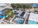 Aerial view of property, showcasing pool and solar panels at 5118 Murray Hill Dr, Tampa, FL 33615