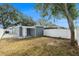 Spacious backyard with grassy area and shed at 5118 Murray Hill Dr, Tampa, FL 33615