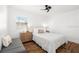 Cozy bedroom with wood flooring and a comfortable bed at 5118 Murray Hill Dr, Tampa, FL 33615