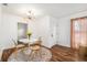 Charming dining area with hardwood floors and modern light fixture at 5118 Murray Hill Dr, Tampa, FL 33615