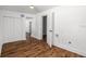 Clean hallway with wood flooring and access to bedrooms at 5118 Murray Hill Dr, Tampa, FL 33615