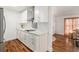 Updated kitchen featuring white cabinets and quartz countertops at 5118 Murray Hill Dr, Tampa, FL 33615