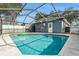 Refreshing screened-in pool in backyard at 5118 Murray Hill Dr, Tampa, FL 33615