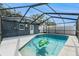 Screened-in pool with a large alligator floatie at 5118 Murray Hill Dr, Tampa, FL 33615