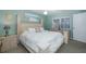 Main bedroom with a king-size bed and en-suite bathroom at 6 Freshwater Dr, Palm Harbor, FL 34684