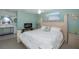 Bright bedroom with king-size bed and access to bathroom at 6 Freshwater Dr, Palm Harbor, FL 34684