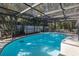 Inviting screened pool with ample space for relaxation at 6 Freshwater Dr, Palm Harbor, FL 34684