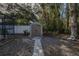 Backyard with storage shed and stone pathway at 6 Freshwater Dr, Palm Harbor, FL 34684