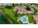 Aerial view of community pool and condo building at 6158 Palma Del Mar S Blvd # 116, St Petersburg, FL 33715