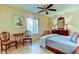 Cozy bedroom with a ceiling fan and a classic-style dresser at 6158 Palma Del Mar S Blvd # 116, St Petersburg, FL 33715